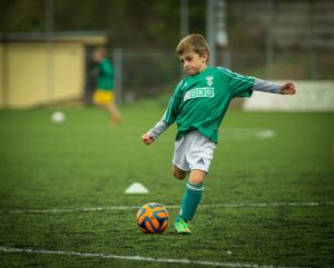 kid playing football